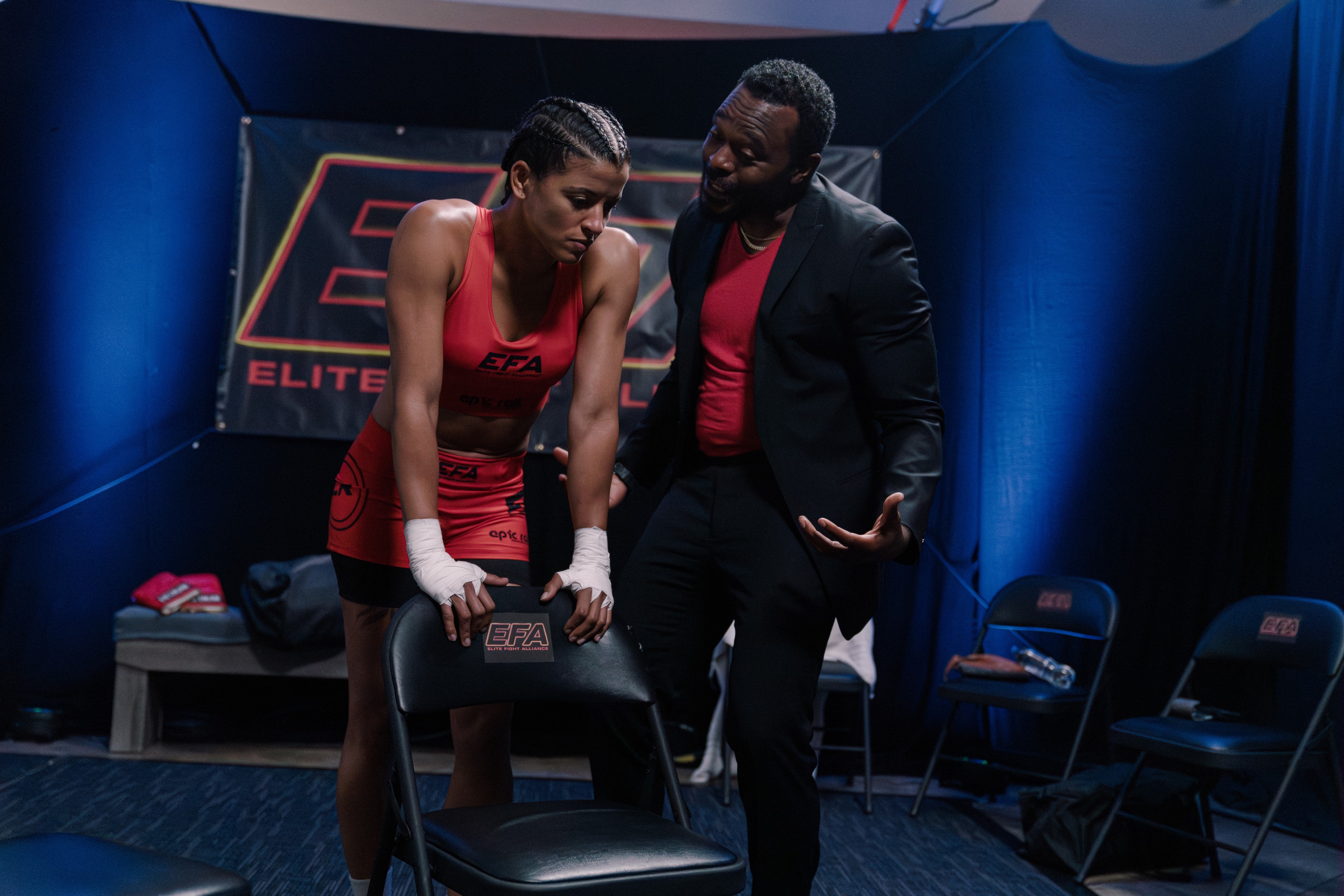 Coach working with the fighter backstage on The Last Round set